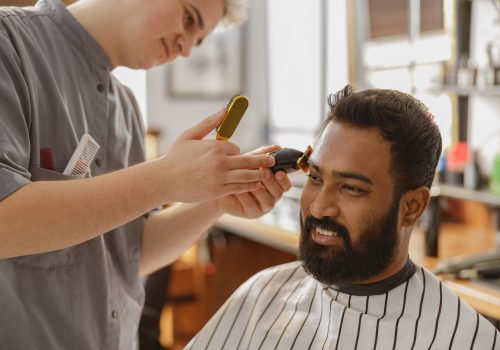 Barber is doing haircut Barber is doing haircut
